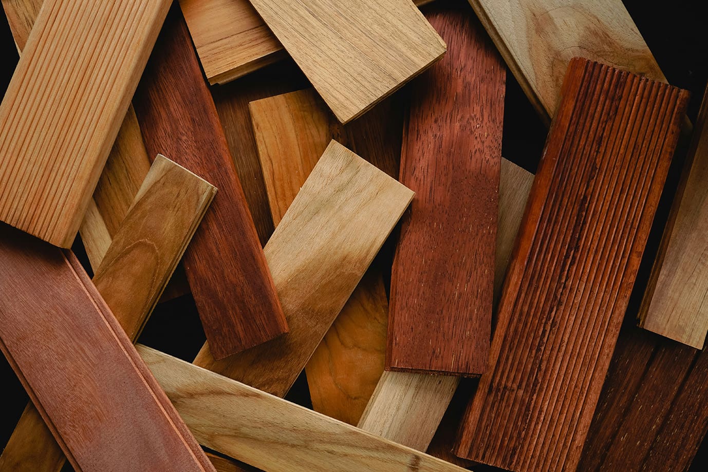A pile of wood that is cut and stacked.