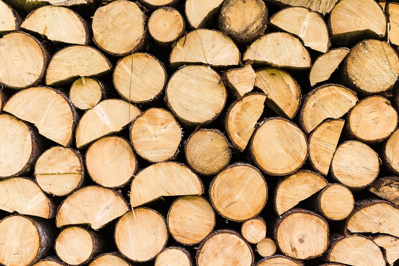 A pile of wood that is stacked on top of each other.