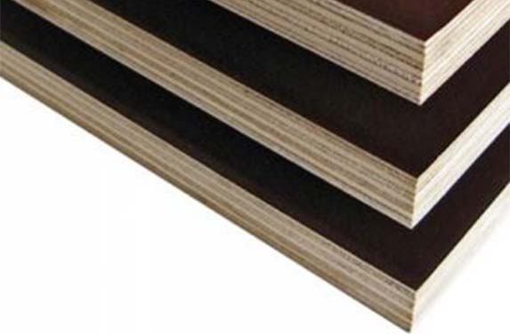 A close up of some brown and black plywood
