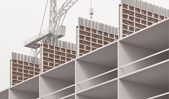 A building with many shelves and some construction equipment