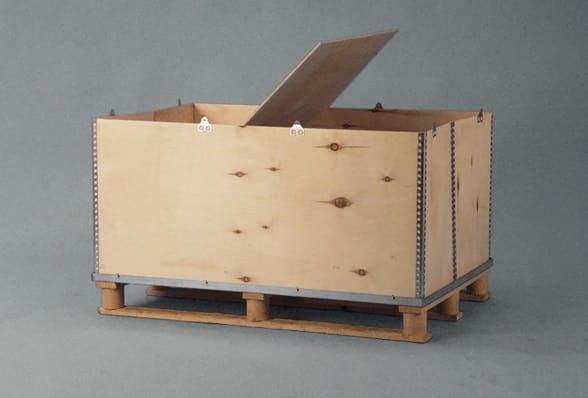 A wooden crate with cardboard on top of it.